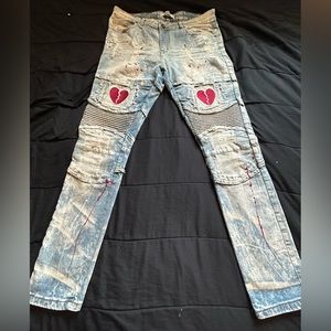 Track 23 "Heartbreaker" design features red splatter distressed beige jeans